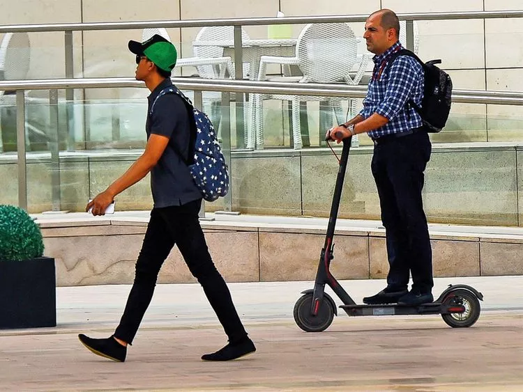 Dubai Police, e-scooter safety, bicycle safety, traffic enforcement, road safety, traffic violations, public awareness, accident statistics, cyclist safety, community collaboration