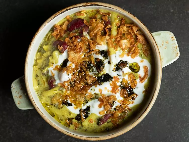 Culinary Journey Iman Nazemi Afghan Delights Dubai Kishmish Afghan Gourmet Kitchen London Afghan Red Crescent Society Bamiya Fried Okra Traditional Naan Kalonji Seeds Culinary Arts Cultural Prejudices Authentic Afghan Cuisine Dubai Dining Experience