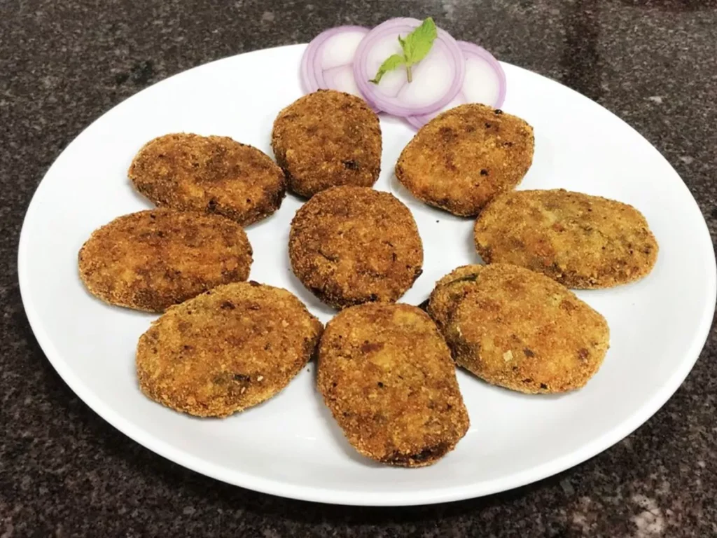 Crispy Mutton Cutlets Recipe Easy Snack Delicious Anytime Snack Mutton Cutlets Hot with Ketchup Quick Recipe Mutton Cutlets Sobha Varghese Gulf News 30 Minute Snack Crispy Cutlets Recipe Boneless Mutton Pieces Turmeric Powder Pepper Powder Potatoes Shallots Ginger Garlic Green