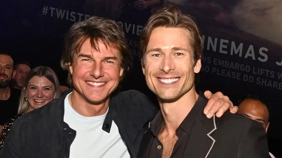 Tom Cruise Glen Powell Twisters Premiere Top Gun Maverick Reunion Top Gun 3 Speculation London Screening Social Media Post Fun Night Friends Movie Casual Look White T-shirt Dark Blue Jeans Black Jacket Black Suit Popcorn Twisters Posters Instagram Caption Wingman Into the Storm
