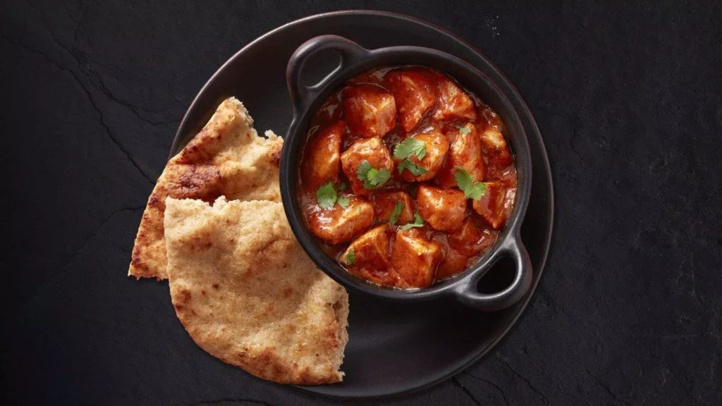 authentic Chicken Chettinad recipe traditional South Indian flavors Tamil Nadu cuisine Chettiar community spices coconut milk easy Chicken Chettinad at home Sunday dinner ideas Indian cooking bold flavors chicken curry recipes South Indian cuisine traditional recipes chicken curry with coconut home-cooked Chettinad chicken Indian heritage food spicy chicken recipes.