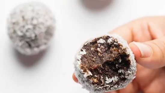 No-Bake Chocolate Coconut Date Balls healthy snacks natural sweetness healthy fats fiber nutritious alternative processed snacks energy boost healthy dessert convenient snack stored in refrigerator up to two weeks easy recipe health benefits ease of preparation health-conscious individuals guilt-free indulgence simple ingredients dates nutrition profile high fiber digestive health antioxidants brain function weight loss treat constipation bone health strengthen immunity prevent diseases