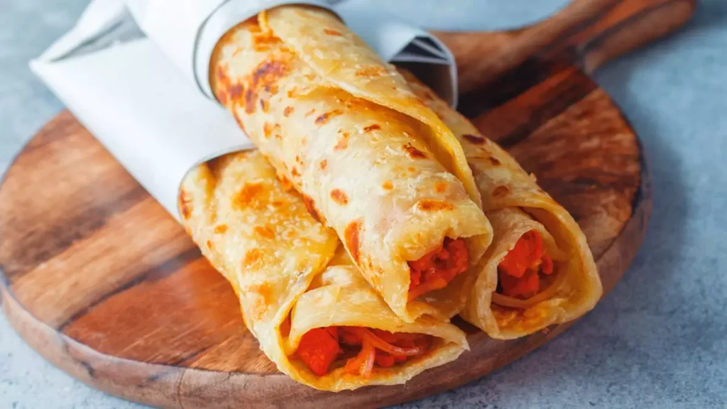 Tandoori veg kathi roll recipe homemade paratha with tandoori vegetables easy kathi roll recipe healthy vegetable roll recipe simple tandoori veggie wrap spicy veggie rolls quick kathi roll vegetarian Indian