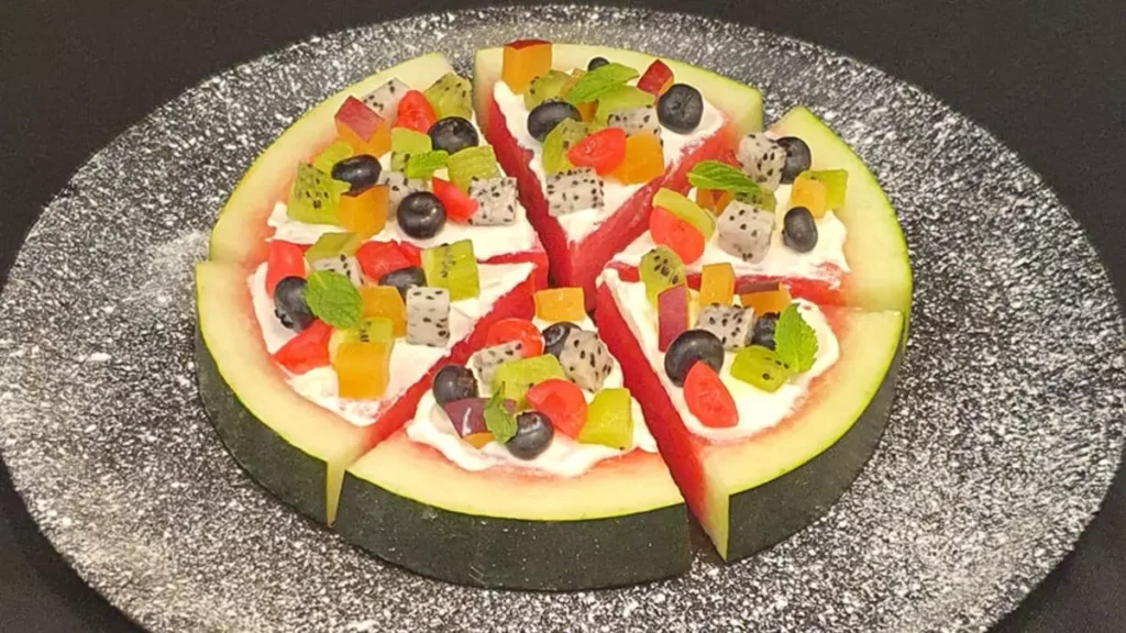 Watermelon pizza recipe watermelon dessert recipe fruit pizza summer recipe healthy fruit dessert no bake watermelon dish cream cheese glaze watermelon recipes watermelon fruit pizza how to make watermelon pizza summer fruit pizza kids friendly dessert watermelon fruit platter unique fruit recipes watermelon snack idea healthy snack watermelon sweet dish watermelon slices with toppings cream cheese and fruit recipe summer party dessert refreshing dessert idea watermelon ideas for summer picnic quick dessert recipe watermelon with Greek yogurt watermelon with orange juice glaze fruit topped watermelon dessert with mint leaves watermelon pizza with