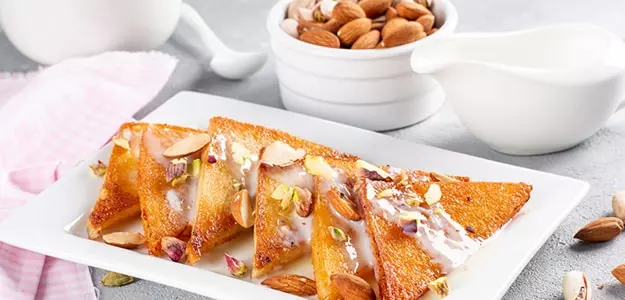 Mango Shahi Tukda recipe Indian desserts easy Shahi Tukda recipe Mango Shahi Tukda with rabri how to make Shahi Tukda at home mango dessert recipe bread pudding Indian sweets with mango quick Indian dessert recipe Shahi Tukda ingredients Mughlai desserts mango infused dessert mango rabri recipe summer desserts Indian festival sweets best Indian dessert recipes mango flavored desserts crispy bread pudding homemade Shahi Tukda recipe authentic Shahi Tukda preparation traditional Indian sweets royal desserts mango rabri with bread