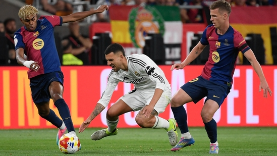 Barcelona vs Real Madrid live streaming El Clasico live match Barcelona Real Madrid La Liga 2025 how to watch El Clasico online FanCode El Clasico 2025 India Barcelona vs Real Madrid today match La Liga live stream Barcelona top of La Liga Real Madrid second place Barcelona Real Madrid head-to-head El Clasico live coverage Barcelona vs Madrid FanCode streaming Barcelona goals vs Real Madrid La Liga title race Robert Lewandowski starting lineup Alejandro Balde Barcelona key players Lamine Yamal El Clasico update