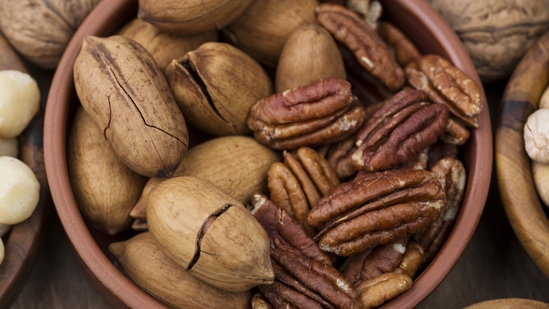 pecan health benefits heart healthy foods pecans for heart health cholesterol lowering nuts antioxidant rich foods dietary fiber sources pecan nuts daily diet healthy heart diet monounsaturated fats heart friendly foods plant sterols natural cholesterol reducers vitamin E rich foods anti inflammatory foods cardiovascular wellness heart disease prevention nuts for cholesterol blood vessel health pecans and fiber digestive health