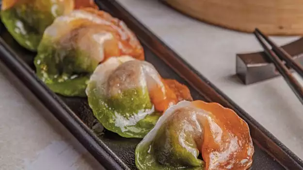 tricolour vegetable dumplings republic day recipe Indian flag dumplings healthy dumpling recipe vegetarian dumplings steamed crystal dumplings potato starch dumplings water chestnut filling asparagus dumpling filling carrot black fungus dumplings how to make tricoloured dumplings green saffron edible food color dumpling dough translucent dumpling wrappers festive Indian snacks dumplings for celebrations republic