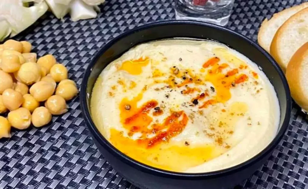 cauliflower stem hummus healthy hummus recipe eco friendly dip sustainable cooking cauliflower dip vegan hummus plant based dip chickpea and cauliflower hummus tahini recipe hummus recipe with stem vegetable dip idea homemade hummus snack ideas cauliflower recipe easy dip recipe high protein dip nutritious vegan dip hummus spread olive oil dip lemon garlic hummus healthy snack idea cauliflower recipes vegetarian dip recipe Middle Eastern style hummus food waste reduction dip healthy cauliflower dish