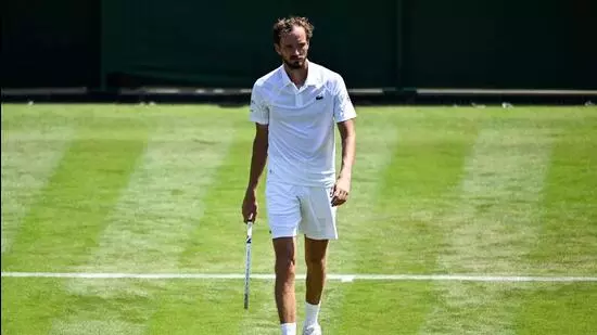 Wimbledon 2025 results Medvedev Wimbledon loss Alcaraz Wimbledon match Wimbledon first round upset Benjamin Bonzi beats Medvedev Carlos Alcaraz survives five sets Wimbledon news today Medvedev poor form Slams Medvedev Grand Slam exit Medvedev Wimbledon performance Medvedev career slump Wimbledon big upsets Wimbledon opening day results Wimbledon grass court battles Alcaraz Wimbledon