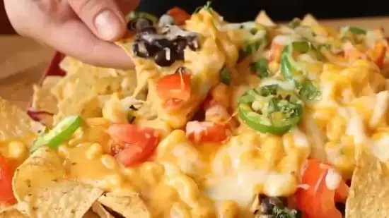 mac and cheese nachos recipe crunchy mac and cheese easy mac and cheese hack party appetizer ideas unique pasta recipes National Mac and Cheese Day recipes comfort food with a twist cheesy nachos recipe vegan nachos idea cheesy party snacks best mac and cheese toppings how to make crispy mac and cheese pasta snack recipes mac and cheese with beans mac and cheese with corn mac and cheese with nachos oven baked mac and cheese nachos how to serve mac and cheese at parties quick party snack ideas cheesy comfort food ideas best party food recipes crowd-pleasing appetizers mac and cheese with tortilla chips baked mac and cheese nachos recipe creative mac and cheese ideas