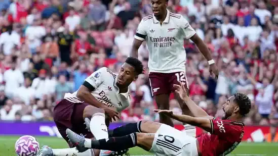 Manchester United Arsenal Premier League Old Trafford William Saliba Matheus Cunha penalty controversy Manchester United vs Arsenal highlights Premier League opening weekend Liverpool vs Bournemouth Chelsea vs Crystal Palace Declan Rice corner Riccardo Calafiori goal Altay Bayindir mistake Andre Onana absence Amorim Manchester United manager Arsenal victory VAR decision referee controversy Premier League news Manchester United penalty appeal Arsenal goal debate Premier League referee decisions Manchester United performance Arsenal performance English football drama Premier League 2025 season Manchester United fixtures Arsenal fixtures Manchester United latest news Arsenal latest news Manchester United results Arsenal results Manchester United penalty not given Arsenal defensive tactics Manchester United goalkeeper error Premier League refereeing debate VAR review Premier League match analysis Manchester United defeat Arsenal win Manchester United penalty shout Arsenal Saliba challenge Manchester United Cunha foul Arsenal Calafiori goal Premier League updates Manchester United highlights Arsenal highlights Premier League live coverage English football updates Manchester United match report Arsenal match report Premier League goals Manchester United season start Arsenal season start Manchester United news today Arsenal news today Premier League referee calls Manchester United fans reaction Arsenal fans reaction Premier League big games Manchester United controversy Arsenal controversy Premier League fixtures Manchester United starting lineup Arsenal starting lineup Manchester United squad Arsenal squad Manchester United manager Amorim quotes Arsenal manager quotes Manchester United vs Arsenal reaction Premier League talking points Manchester United attack Arsenal defense Manchester United midfield Arsenal midfield Manchester United strikers Arsenal forwards Manchester United Cunha penalty Arsenal Saliba foul Manchester United Calafiori goal Arsenal Bayindir error Manchester United goalkeeping mistake Arsenal set piece Manchester United vs Arsenal live Manchester United Premier League 2025 Arsenal Premier League 2025 Manchester United vs Arsenal score Manchester United vs Arsenal result Manchester United vs Arsenal penalty debate Premier League VAR issues Manchester United Premier League table Arsenal Premier League table Manchester United vs Arsenal refereeing Manchester United vs Arsenal full match Manchester United vs Arsenal player ratings Manchester United vs Arsenal summary Manchester United controversial penalty Manchester United vs Arsenal match facts Manchester United vs Arsenal goals Manchester United vs Arsenal referee decision Manchester United vs Arsenal drama Manchester United vs Arsenal review Manchester United vs Arsenal late penalty Manchester United vs Arsenal missed foul Manchester United vs Arsenal protests Manchester United vs Arsenal highlights video Manchester United vs Arsenal football match Manchester United vs Arsenal England Premier League football news sports updates Manchester United transfer news Arsenal transfer news Manchester United upcoming fixtures Arsenal upcoming fixtures Manchester United match highlights Arsenal match highlights Premier League match week one Manchester United vs Arsenal analysis Manchester United vs Arsenal breakdown Manchester United goalkeeper situation Arsenal defensive performance Manchester United coaching staff quotes Arsenal manager comments Manchester United season hopes Arsenal season hopes Manchester United rivalries Arsenal rivalries Manchester United vs Arsenal historical rivalry Manchester United title challenge Arsenal title challenge Manchester United Champions League Arsenal Champions League Manchester United vs Arsenal trending news Manchester United football updates Arsenal football updates Manchester United official website Arsenal official website Manchester United vs Arsenal penalty incident Manchester United vs Arsenal controversial decision Manchester United football club Arsenal football club Manchester United vs Arsenal sports desk Manchester United vs Arsenal HT Sports Desk