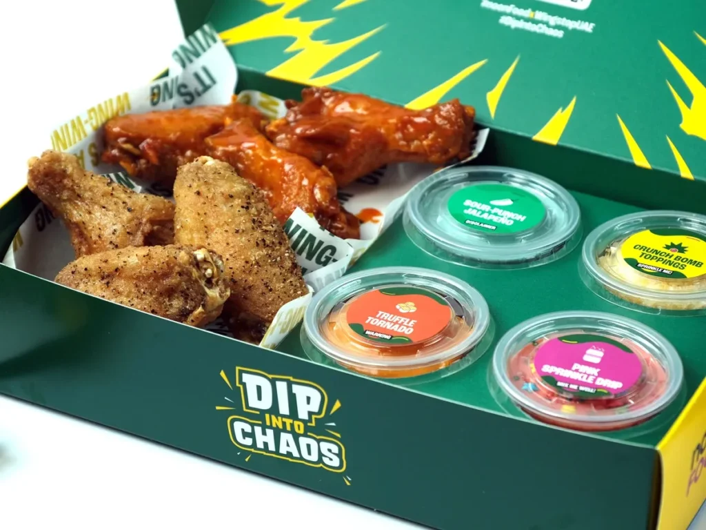 Wingstop wings noon Food Wingstop UAE Dip Into Chaos wings box limited time wings special sauce wings flavors truffle tornado sauce sour punch jalapeno sauce pink sprinkle drip sauce crunch bomb toppings Apple product giveaway iPhone iPad AirPods win Apple gadgets social media contest QR code scan reaction video hashtags DipIntoChaos noonFoodxWingstopUAE tag noon_uae WingstopUAE flavor adventure bold sauces limited edition wings box online food delivery Dubai wings order food delivery app finger licking good wings challenge vote favorite sauce Instagram contest video guide special offers exclusive wings deals Dubai food promotions UAE food contests noon Food app download best wings deals wings delivery UAE wings food apps best sauces for wings food competitions Dubai dining events