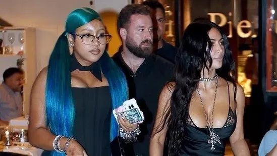 North West Kim Kardashian Rome North West fashion Kim Kardashian style North West goth look Kim Kardashian daughter North West steampunk boots North West electric blue hair North West corset outfit Kim Kardashian black dress Kim Kardashian Rome dinner North West Vivienne Westwood bag Kim Kardashian silver chains North West Chrome Hearts glasses North West TikTok fashion Kim Kardashian Met