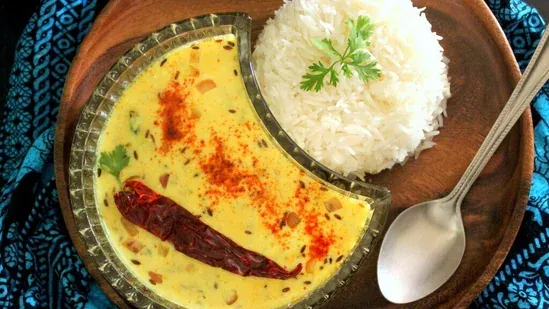 spring onion kadhi recipe how to make spring onion kadhi kadhi chawal recipe rainy day comfort food monsoon special dish easy kadhi recipe spring onion dishes dahi besan curry indian comfort food home-style kadhi traditional Indian recipe rainy season Indian food vegetarian Indian curry healthy Indian food Indian lunch recipes curd based curry kadhi rice combo best kadhi chawal homemade kadhi chawal simple