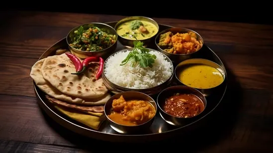 Indian thali healthy heart thali balanced Indian plate heart-healthy meals Indian diet Indian nutrition rotis complex carbohydrates protein vegetables dals paneer rajma chana brown rice jowar bajra seasonal grains Max Hospital Dr Naveen Bhamri cardiologist heart wellness Indian meals thali tips balanced diet Indian cuisine healthy eating traditional Indian food Indian superfoods Indian food for heart Indian meal portions Indian meal guide Indian diet plan Indian vegetarian protein Indian non vegetarian protein Indian thali