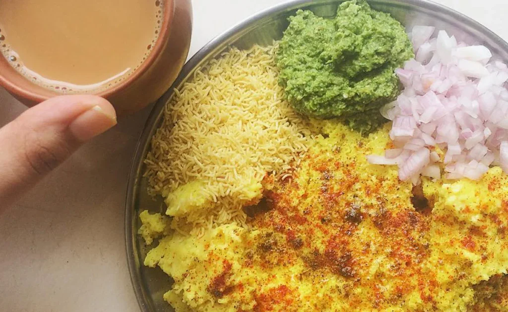 Surti Locho recipe Gujarati snack easy Surti Locho street food protein packed dhokla style breakfast tangy soft spongy healthy traditional cooking ideas urad dal chana dal poha sour curd ginger chilli paste turmeric hing fruit salt steamed snack onion sev topping Gujarati cuisine quick snack easy breakfast protein rich street food homemade Surti Locho step by step recipe authentic Surti Locho South Asian food vegetarian recipe easy Gujarati