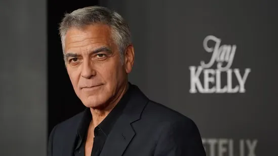 George Clooney Paul Newman advice fame Hollywood 1990s Clooney interview Clooney Sandler conversation Clooney Newman meeting Warner Bros Message in a Bottle ER actor story celebrity life lessons Clooney career growth Newman legacy film industry insights Clooney Jay Kelly Netflix release Hollywood icons actor mentorship journey