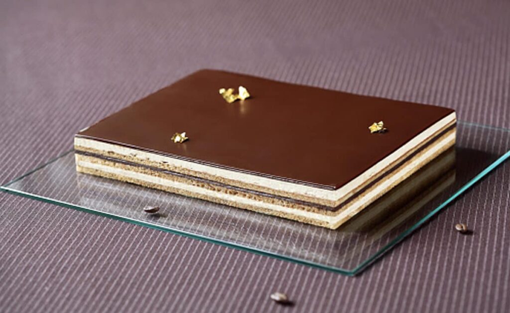 Opera Cake French dessert coffee buttercream chocolate ganache almond sponge classic pastry bakery recipe homemade Opera Cake authentic French recipe layered cake gourmet dessert coffee flavored cake chocolate glaze espresso cake Paris dessert patisserie style cake elegant dessert European baking food lovers cake for celebrations rich chocolate