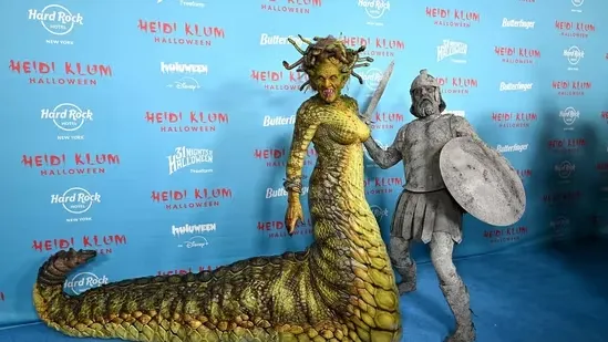 Heidi Klum Medusa costume 2025 Halloween party Tom Kaulitz Halloween transformation Greek mythology Halloween look celebrity Halloween costumes Mike Marino prosthetics New York Halloween event Queen of Halloween Heidi Klum Halloween legacy stone warrior look Halloween red carpet creative celebrity costumes Hollywood Halloween party mythical character costume serpent headpiece Halloween makeover iconic Halloween outfits celebrity couple costumes dramatic Halloween entrance spooky celebration trending