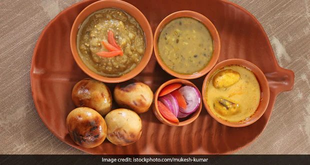 Dal bafla recipe dal bafla how to make dal bafla traditional dal bafla Madhya Pradesh cuisine Indian dal recipe wheat bafla recipe boiled bafla baked bafla homemade dal bafla step by step dal bafla dish easy dal recipes best dal bafla ghee dal bafla toor dal recipe dal tadka for bafla regional Indian recipes authentic MP recipes Indian comfort food healthy Indian meals ghee recipes vegetarian Indian food vegetarian protein Indian lunch ideas wheat and maize flour recipe festive food India rustic Indian dishes local Indian dishes