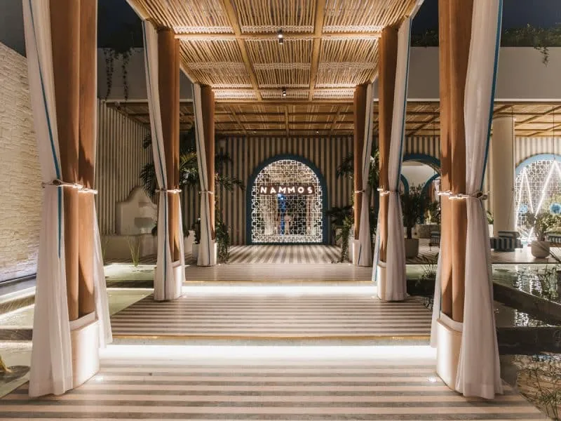 Maluma Nammos Dubai New Year 2026 celebration live music beach party Mediterranean Asian cuisine Crudo Bar Four Seasons Resort Jumeirah Beach Greek Cycladic architecture indoor outdoor dining cabanas tanning beds beach bar