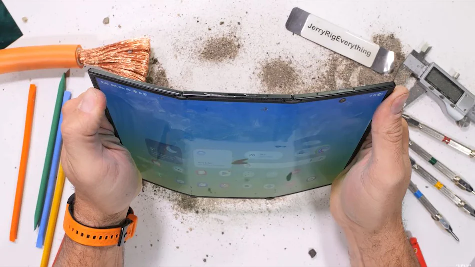 Samsung Galaxy Z TriFold durability test fails bend test scratch test fire test JerryRigEverything YouTube review plastic inner screen Gorilla Glass Ceramic 2 outer screen Armor Aluminium frame hinge issues antenna line weakness foldable phone break scratches OLED display burn test dirt resistance test foldable