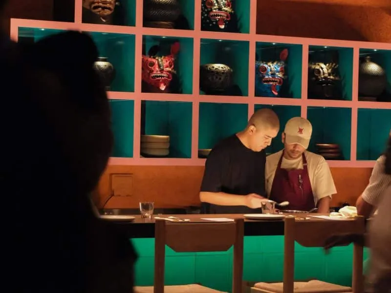 Cocina Tres Dubai Mexican restaurant Honeycomb Hi-Fi Pullman Downtown Business Bay authentic Mexican cuisine Baja fish tacos pescado zarandeado fideo seco handmade tortillas Oaxacan corn wood-fire grill artisanal cocktails frozen beverages house-infused drinks Mexican flavors vibrant interiors geometric columns Luis Barragán inspired terrace sunny vibes rustic hacienda ambiance tiger masks ceviche bar chefs from Mexico sharing plates dining in Dubai coastal Mexico escape Mexican gastronomy traditional Mexican