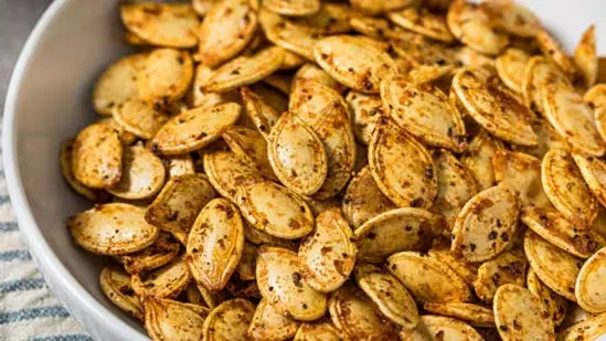 roasted pumpkin seeds winter snack healthy pumpkin seeds protein rich snacks homemade roasted seeds peri peri pumpkin seeds salted pumpkin seeds cinnamon pumpkin seeds winter healthy snacks easy seed recipes plant protein snacks fibre rich