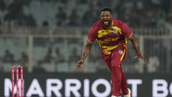 Romario Shepherd T20 World Cup Romario Shepherd hat trick West Indies vs Scotland T20 World Cup 2026 West Indies cricket Romario Shepherd five wicket haul T20 World Cup history West Indies fast bowler Romario Shepherd record Romario Shepherd figures five for 20 Scotland vs West Indies match T20I hat trick Romario Shepherd Malinga Southee Cummins list West Indies bowling performance Romario Shepherd over