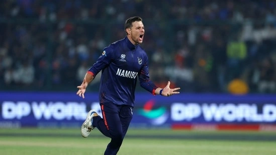 Gerhard Erasmus Namibia captain India vs Namibia T20 World Cup 2026 Gerhard Erasmus bowling spell Namibia cricket news India Namibia match Delhi T20 World Cup Arun Jaitley Stadium Rod Tucker umpire controversy Gerhard Erasmus argument India batting collapse T20 World Cup Group A Namibia vs India highlights Ishan Kishan fifty Tilak Varma wicket Hardik Pandya dismissal Shivam Dube out Namibia bowling