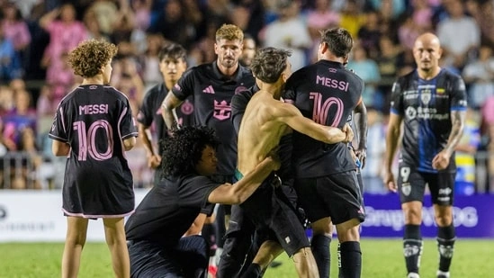 Lionel Messi pitch invasion Inter Miami friendly Puerto Rico football match Messi knocked down Messi security incident Inter Miami vs Independiente del Valle Messi penalty goal Puerto Rico Bayamon stadium Messi 2026 news Messi latest match report Inter Miami win 2 1 Messi fan selfie incident football pitch
