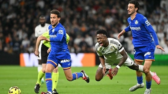 Real Madrid vs Getafe La Liga 2026 Real Madrid loss today Getafe win at Bernabeu La Liga title race update Barcelona lead La Liga standings Alvaro Arbeloa Real Madrid coach Martin Satriano goal highlight Vinicius Junior performance today Kylian Mbappe injury update Real Madrid Franco Mastantuono red card La Liga