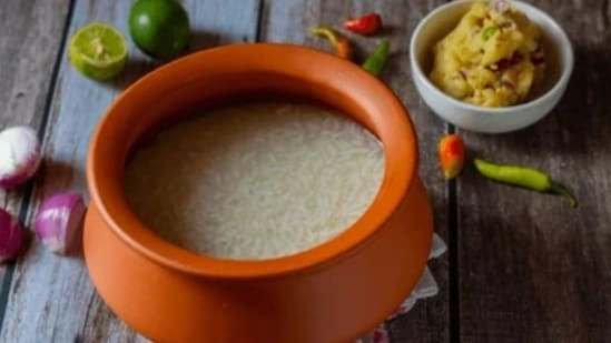 Poita Bhat recipe Bohag Bihu food Assamese breakfast fermented rice recipe summer cooling foods India traditional Assamese food Bihu special recipe Poita Bhat benefits fermented rice health probiotics food India